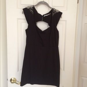 Black mini dress with shoulder embellishments